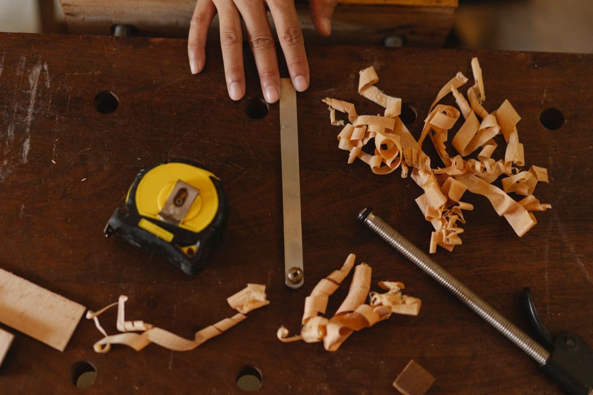 A carpenter's hand tools on a wooden workbench