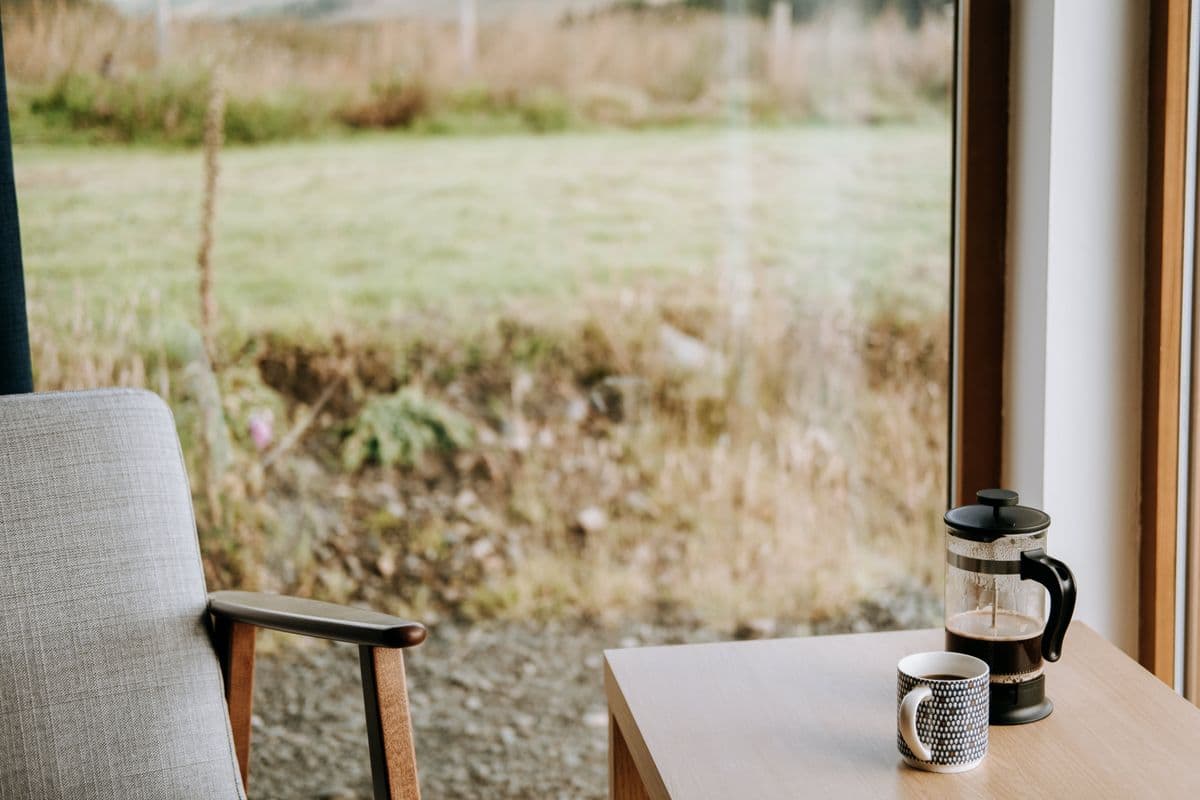 A quiet cup of coffee by a window in morning light